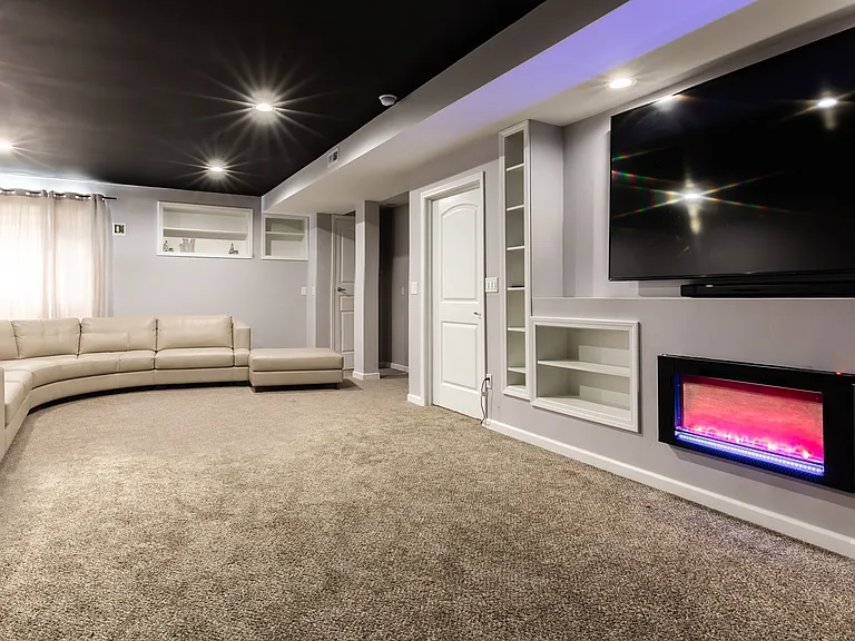 Home theater in lower level w/fireplace