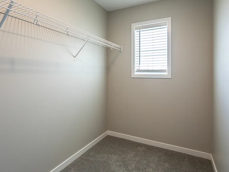 Primary walk in closet.