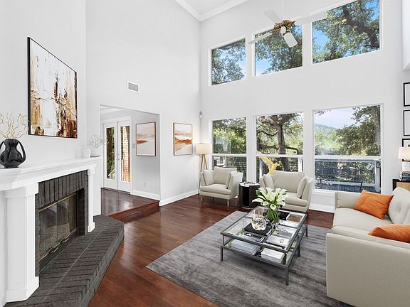 A reimagined spacious living room with an abundance of natural light.