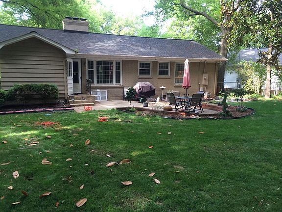 Fenced-in backyard with lawn service 