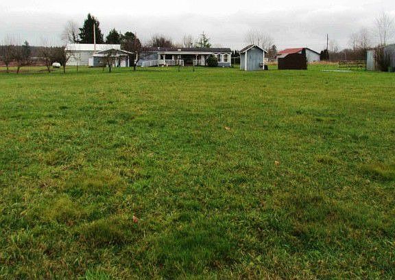 Great well drained sandy loam soil graces this mid-county mini-farm. Orchard right in the middle of 