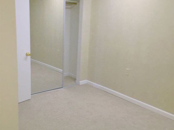 Bedroom has lots of closet space.