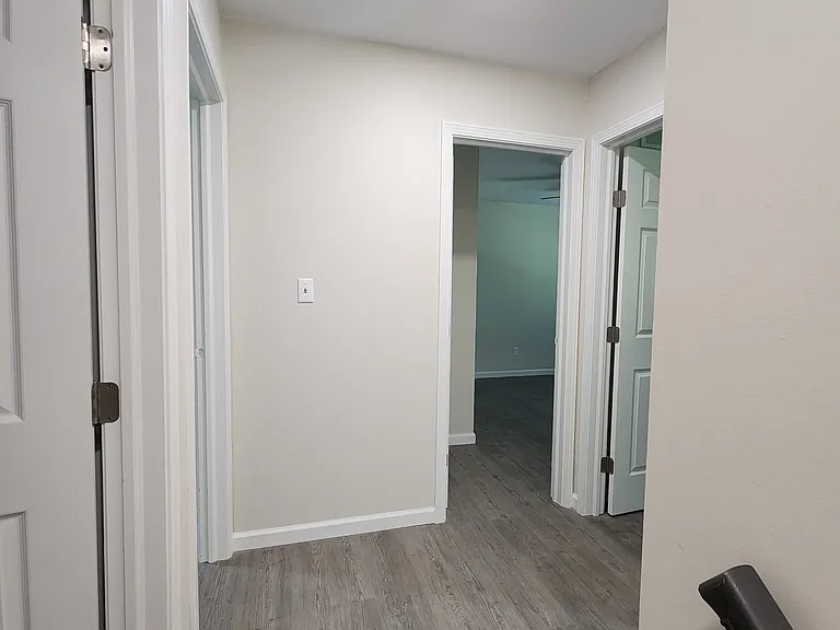 Upstairs hallway- first door on left side is 2nd bathroom, masterroom entry on left side, door straight ahead is 3rd bedroom, 4th bedroom on right side, hallway closet on left side (not visible here)