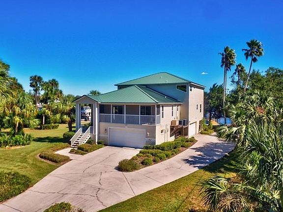 Garage space for up to 6 vehicles.   Entire lower level is unfinished garage -  turn it into livable space - add a rental suite 