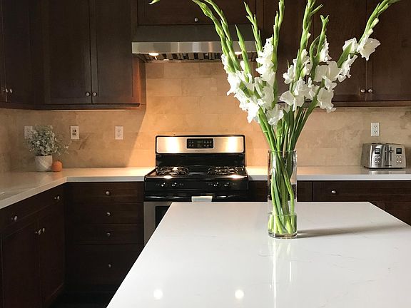 Kitchen with newly installed quartz counterops