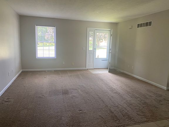 Upstairs Livingroom open to the kitchen