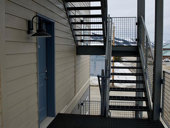 Granby Dairy Suites - exterior stairs leading to suites on second and third floors