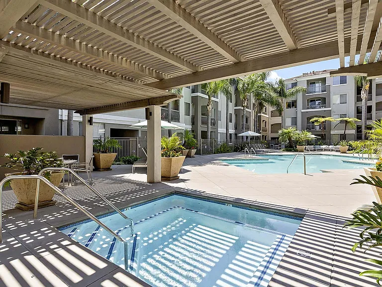 Escape the sun and unwind in the shaded hot tub or dive into the sparkling pool for pure relaxation.