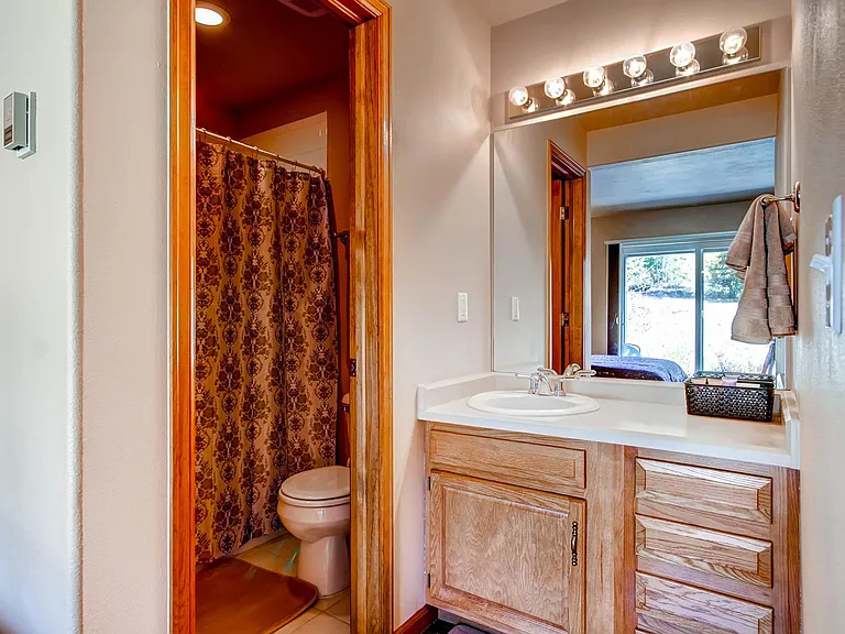 First floor bedroom with private vanity and bathroom