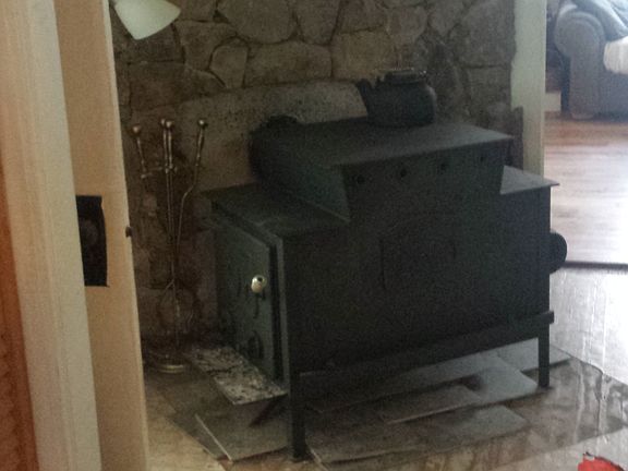 working wood stove on rock w