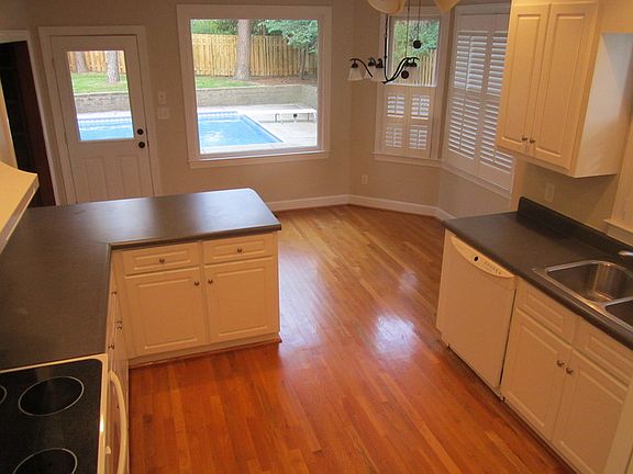 Kitchen andView : Eat in kitchen includes view of large pool and spacious backyard.