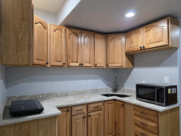 Gourmet, luxury kitchenette with dual induction burners, multifunction combo microwave/air fryer oven, and full size refrigerator (nearing completion).