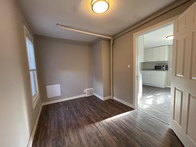Second bedroom with vinyl plank flooring approx 8 x 10.