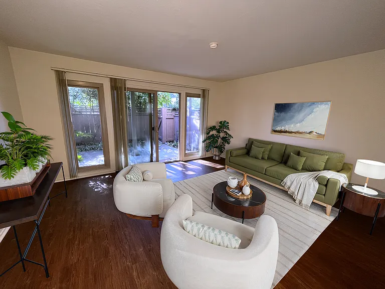 Furnished Jr 1 BR (downstairs), looking out onto private, shaded patio.
