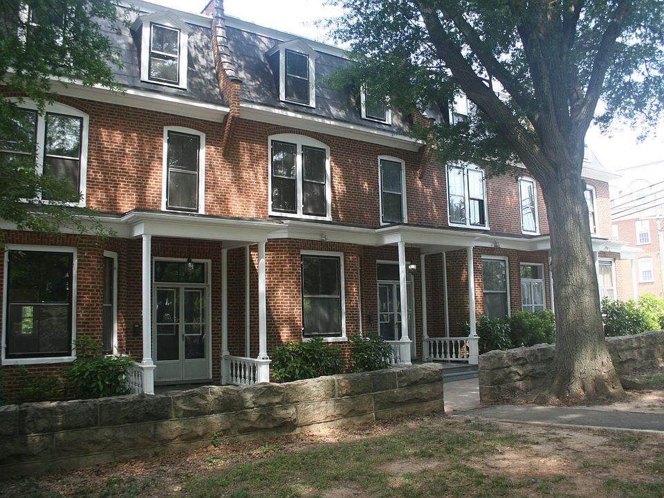 306 has porch on front, facing Cedar Avenue, can also enter directly from parking lot into kitchen on rear