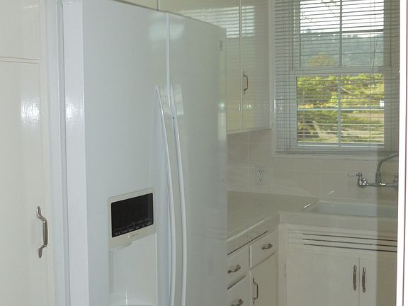 Kitchen with new white tile floor