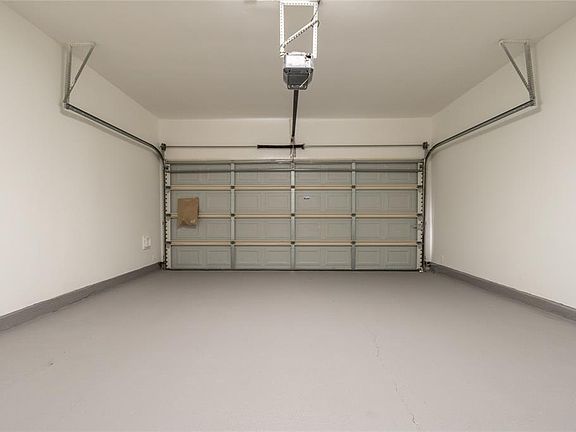Don't overlook the garage as offers space for two vehicles as well as recent textured paint on floor. Garage door opener updated in April 2018 for added security and ease.