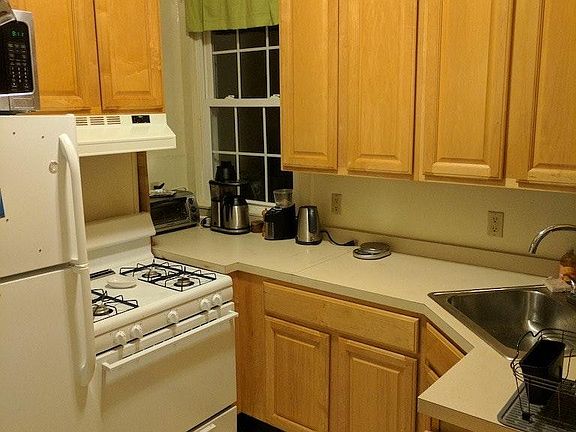 Kitchen with Hardwood cab., microwave, gas stove
