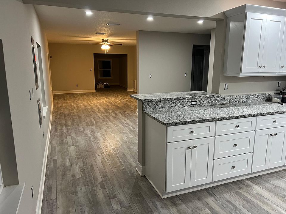 kitchen overlooking dining and living rooms