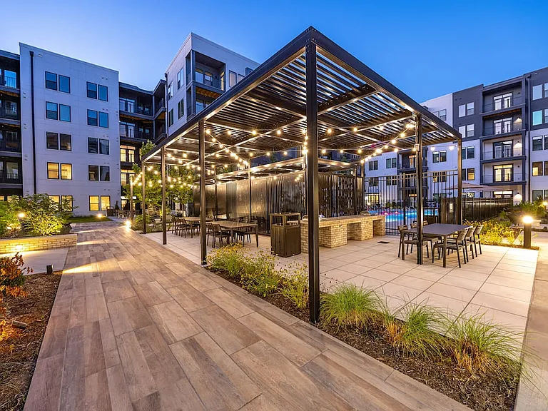 Courtyard with barbecue grills and dining tables