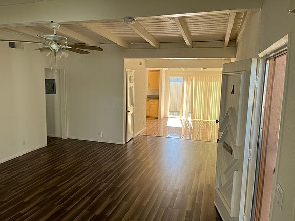 Family room leads to dining are and kitchen with direct access to the back patio. Upgraded Sliding door and new vertical blinds.