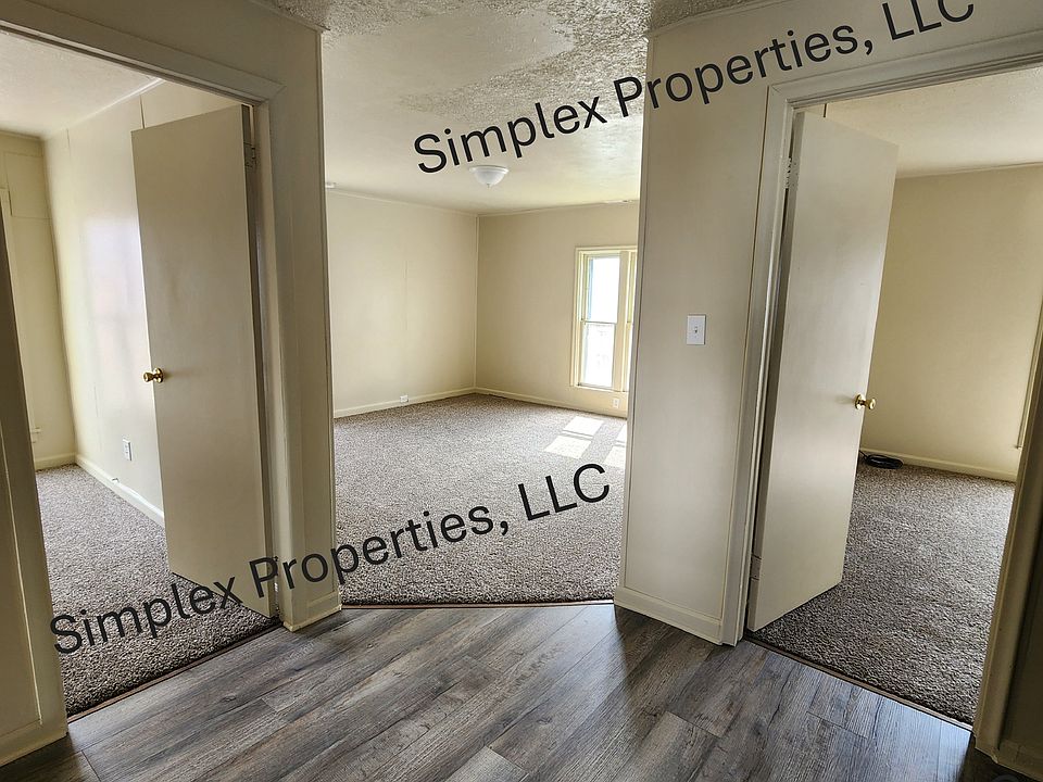 Bedroom doorways with Living Room in center