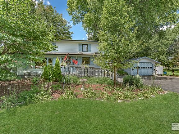 COUNTRY CHARMER ON ALMOST 3/4 ACRES HAS IT ALL...FRONT PORCH, BACK DECK, COLORFUL GARDENS, LOTS OF D