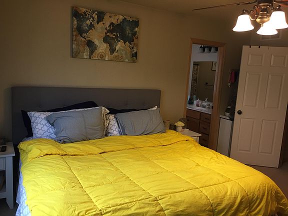Master bedroom with attached master bathroom and walk-in clo