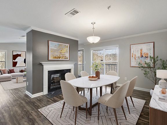 Dining area centered around a warm fireplace setting