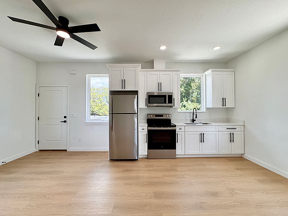 Open kitchen and living space with ample natural light.