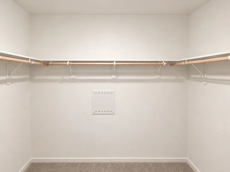 Oversized walk-in closet designed for maximum storage and convenience.