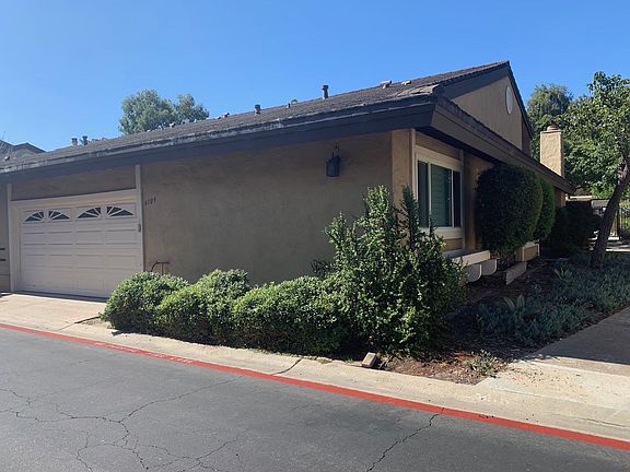 Garage/front of house. Walkway to front door on the right.