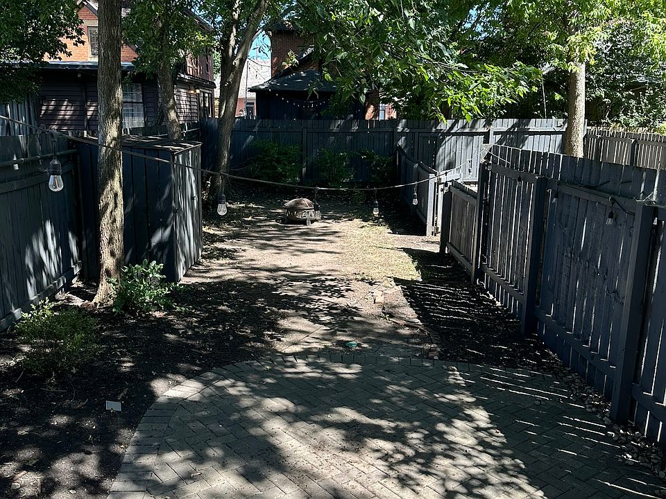 Private back brick patio w/ fenced in yard and shed (+ fire pit)