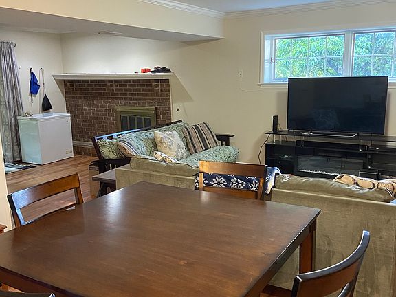 Expansive living area, open space for dining/lounging, wood fireplace