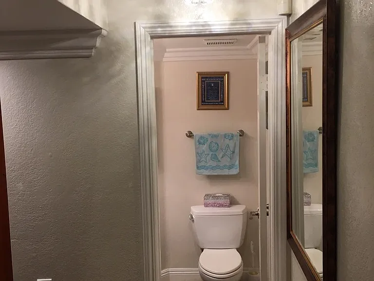 New chandelier at the beginning of staircase to your FURNISHED guest bedroom