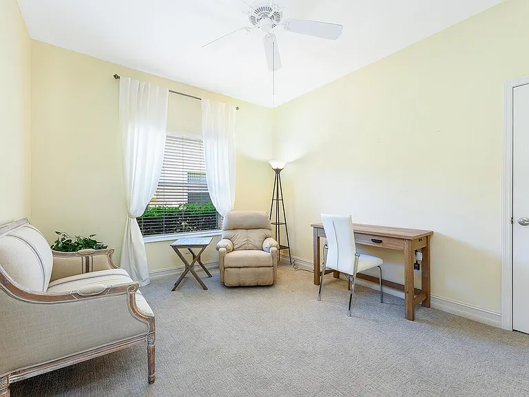 Den with desk and seating