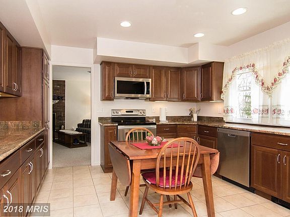Abundant Cherry Cabinets & Granite Counters