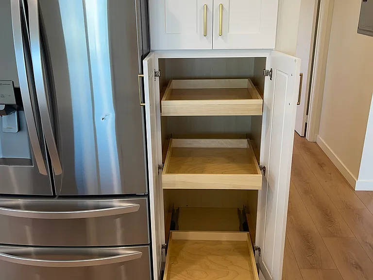 Three pull-out drawers for kitchen storage. Great way to access pots and pans.