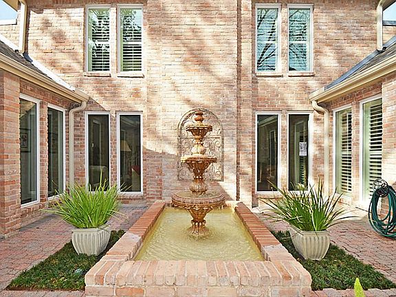 Courtyard Entry w/ Fountain and Private entrance to Front Door!