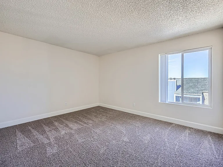 Experience the tranquility of this spacious, well-lit room designed for comfort.