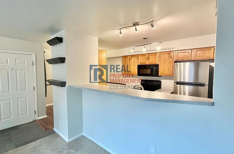 10784 W 63rd Pl #103 — Photo 5