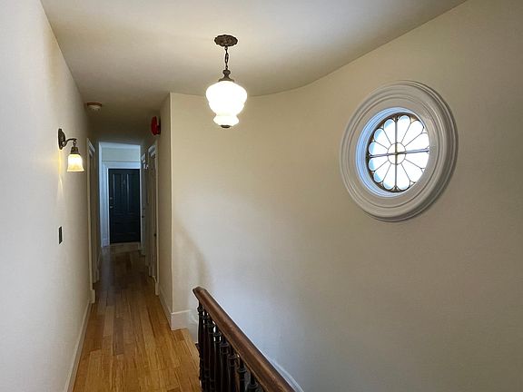 Second floor stair and hallway leading to unit 5 plus rear egress