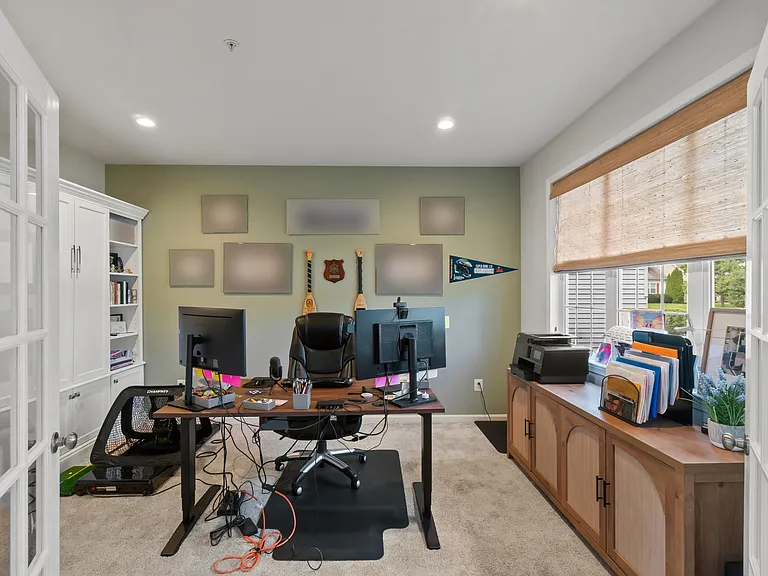 Downstairs private office space with built in shelving and bonus murphy bed for additional guest quarters.