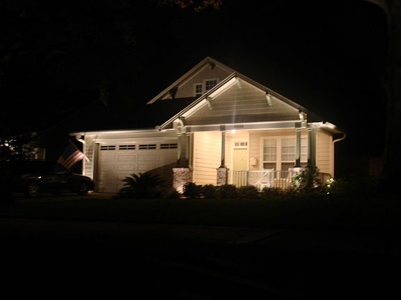 Front of the house at night with professional lighting