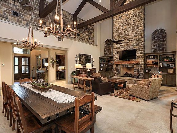 30 FT STONE FIREPLACE WITH HEARTH! WALL OF FRENCH DOORS THAT LEAD TO PATIO AREA! GREAT FRO ENTERTAINING!