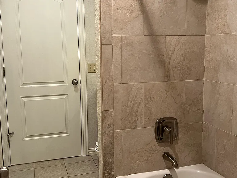Remodeled bath with new tile and fixtures