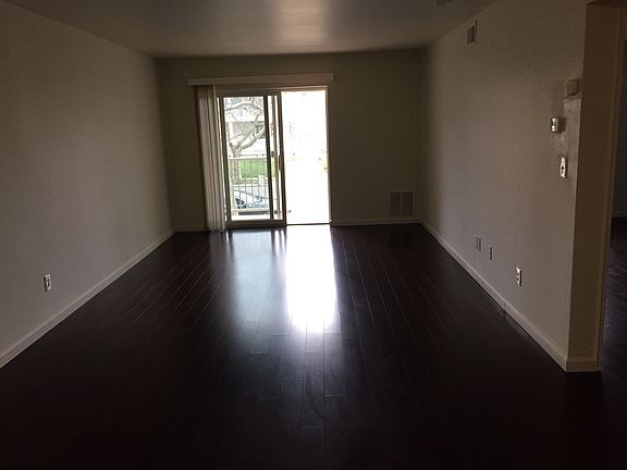 living room leading to outside balcony