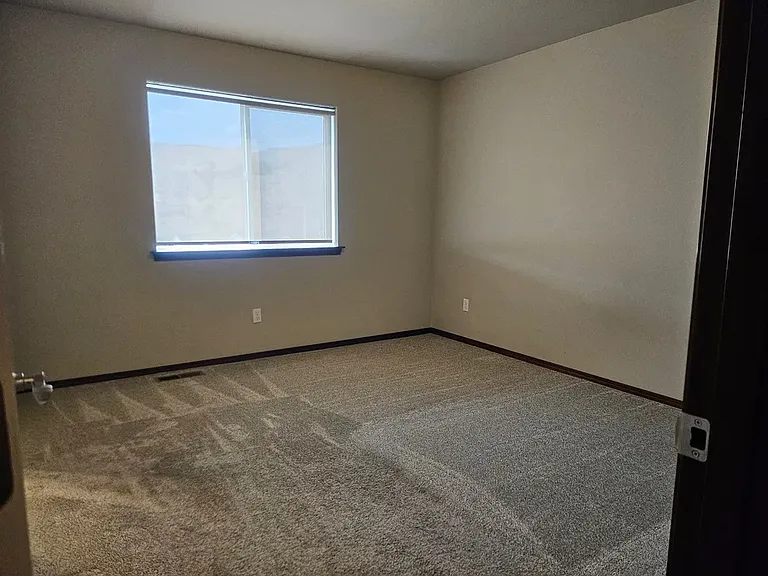 Primary bedroom. Shade different from what is pictured here. The room has a BLACKOUT, top down, bottom up cellular cordless shade.