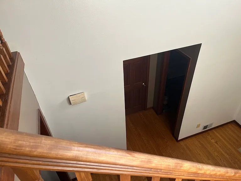 door to first floor bedroom from staircase view