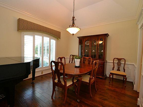 The dining room features gorgeous 5 inch hand scraped hardwood floors, gambrel ceilings, dental crow
